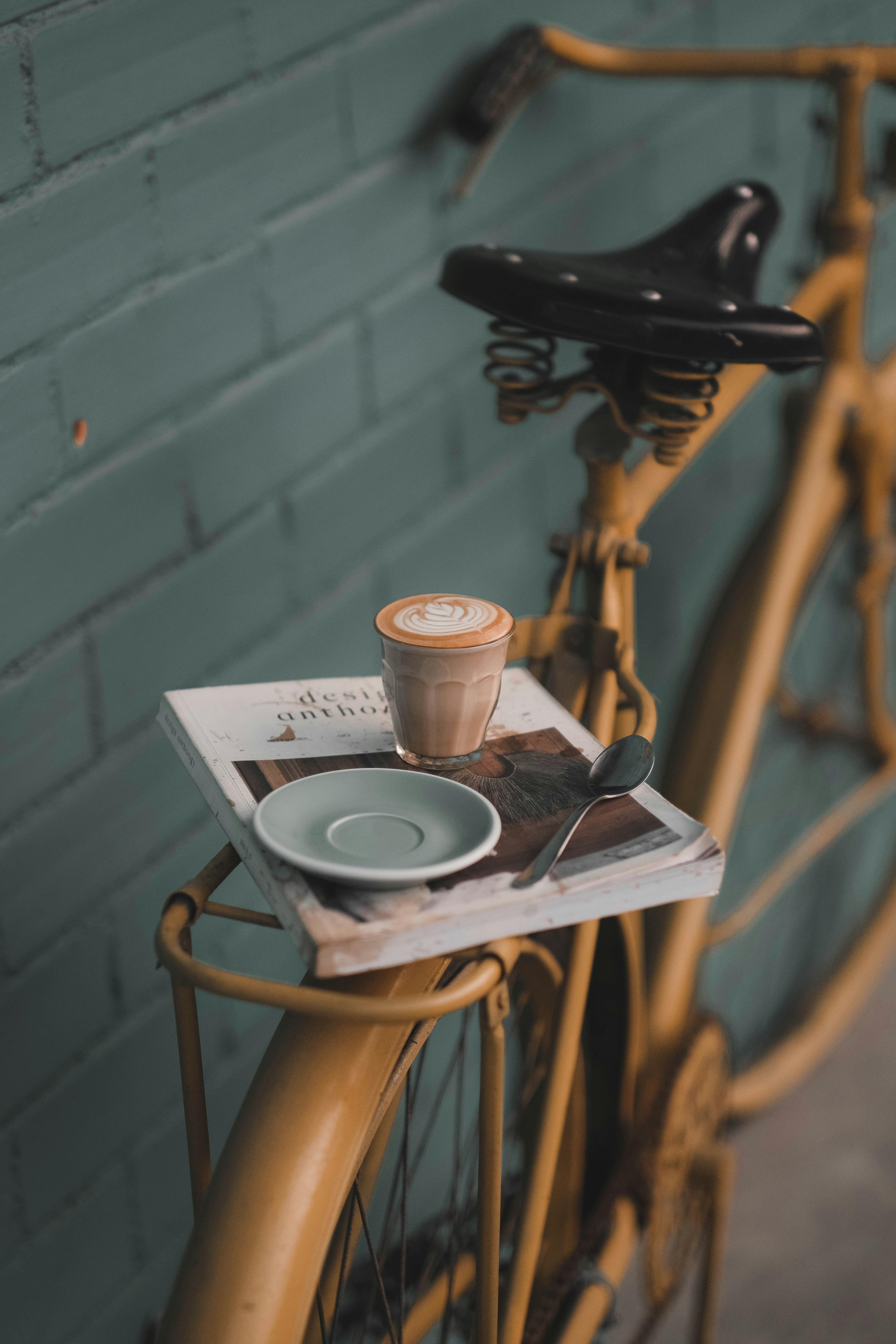 filled cup near saucer on bike